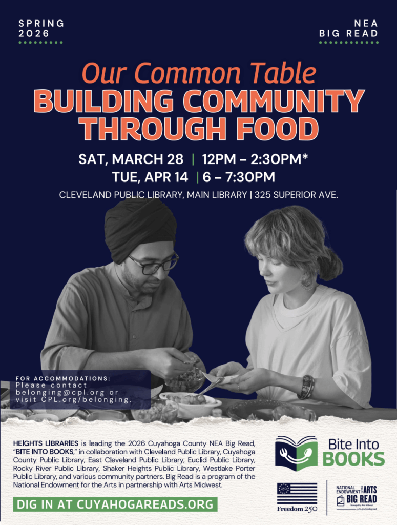 Two people sitting at a table using their hands to prepare food.