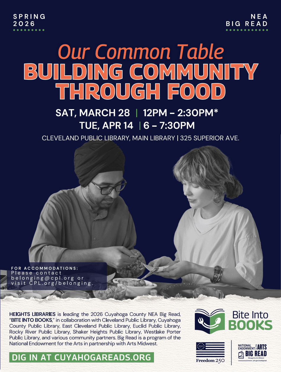 Two people sitting at a table using their hands to prepare food.